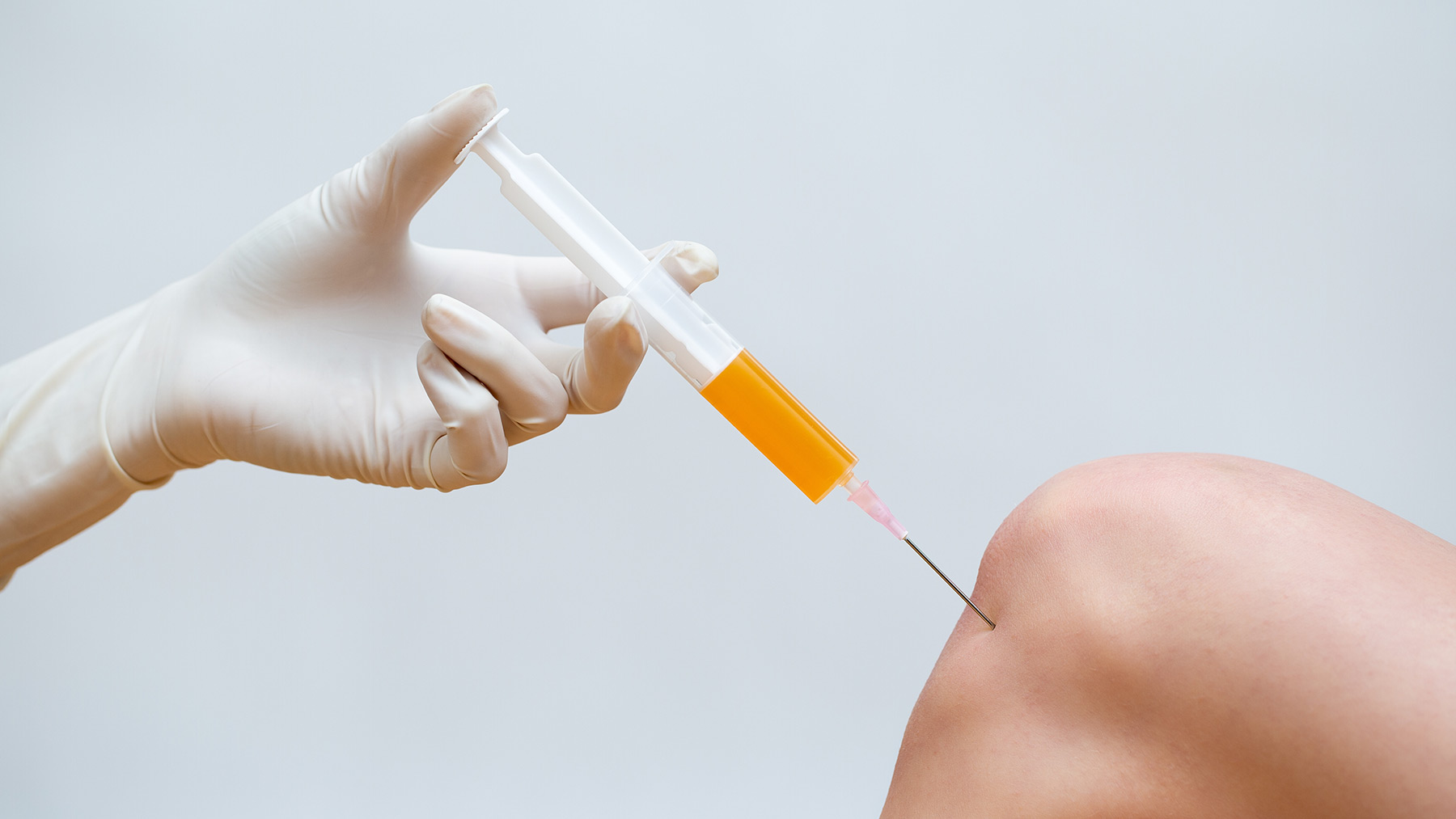 woman getting prp injection to repair knee